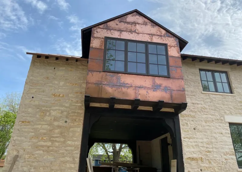 Copper metal panel facade on a stone building for Metal Roof Coating in Lenoir